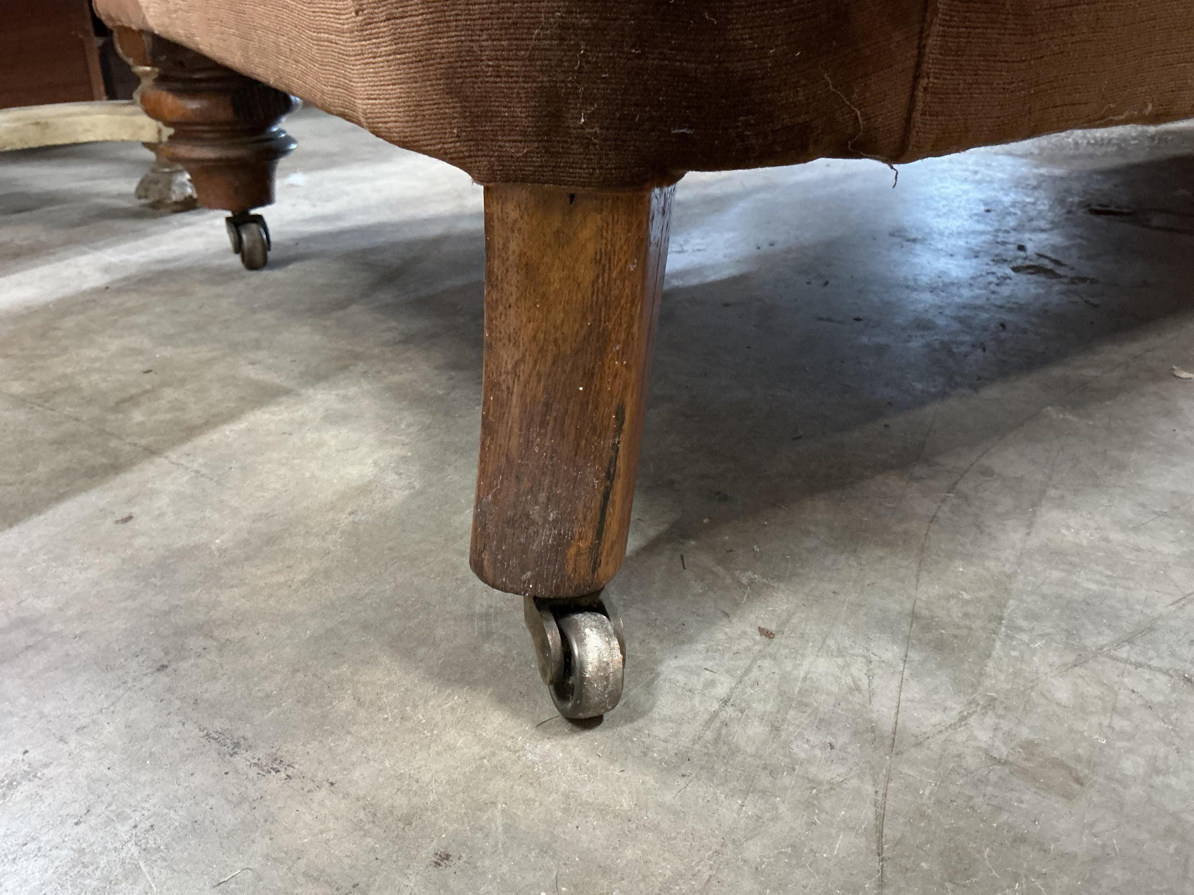 A Victorian upholstered Chesterfield settee, width 206cm, depth 82cm, height 66cm